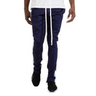 Stylish joggers for men in navy blue with light blue side panels and adjustable drawstring