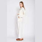 Emory Park stylish long sleeve crop shirt in cream paired with white high-waisted pants for a chic look