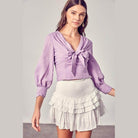 Do + Be Collection stylish long sleeve shirt in lavender with a bow detail for a chic look