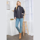 Stylish quilted coat by Orange Farm Clothing, paired with jeans and ankle boots for a chic look