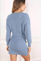 Back view of a stylish ribbed knit ensemble in blue, featuring a fitted design and long sleeves