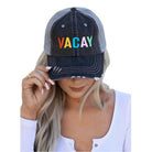Stylish travel hat for women featuring a distressed design and colorful VACAY lettering