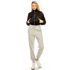 Andante USA stylish travel jacket in black worn with grey joggers for a chic casual look