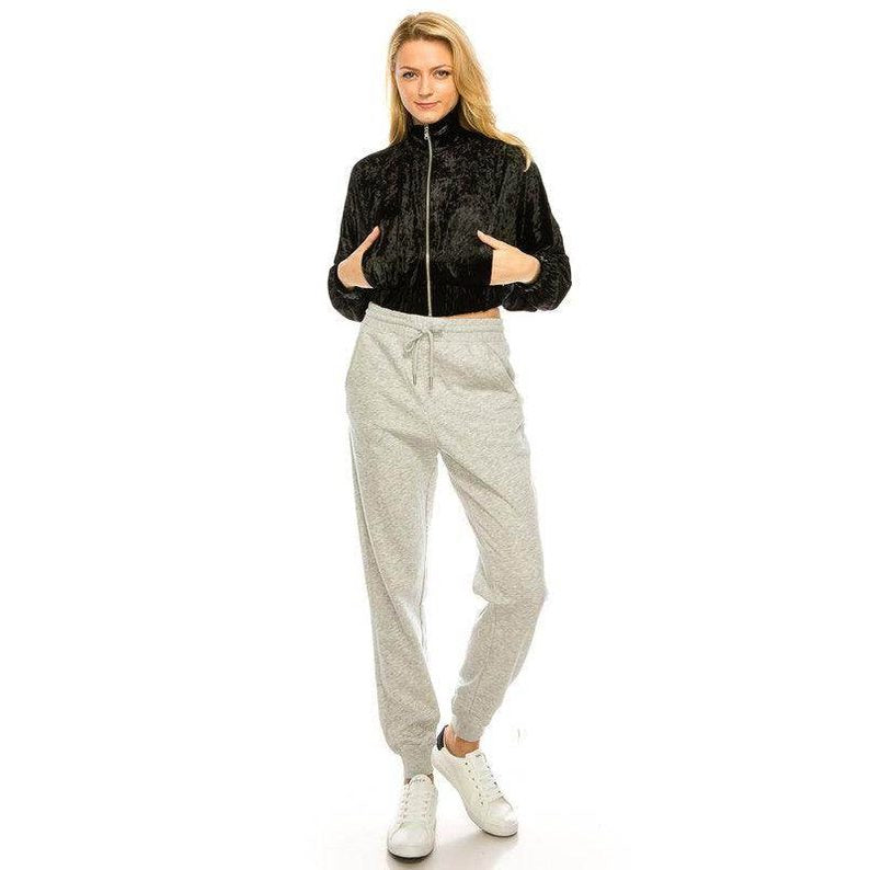 Andante USA stylish travel jacket in black worn with grey joggers for a chic casual look