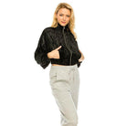 Women’s stylish travel jacket in black with front pockets and a cropped design for effortless style