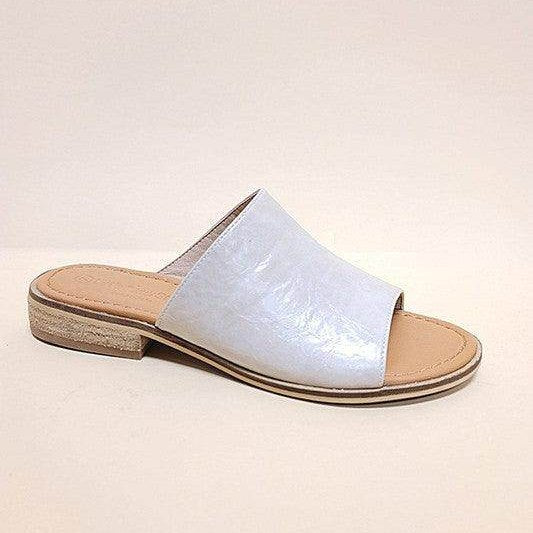 Stylish travel slides for women in light blue with a comfortable flat design