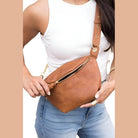 Aili's Corner stylish travel waist pack in brown leather with adjustable strap and zipper closure