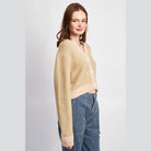 Emory Park stylish vacation cardigan in beige with pink trim, perfect for layering on warm getaways
