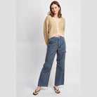 Emory Park stylish vacation cardigan in tan with button closure, paired with blue wide-leg jeans