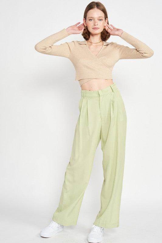 Emory Park stylish vacation crop top in beige paired with light green pants for a trendy summer look