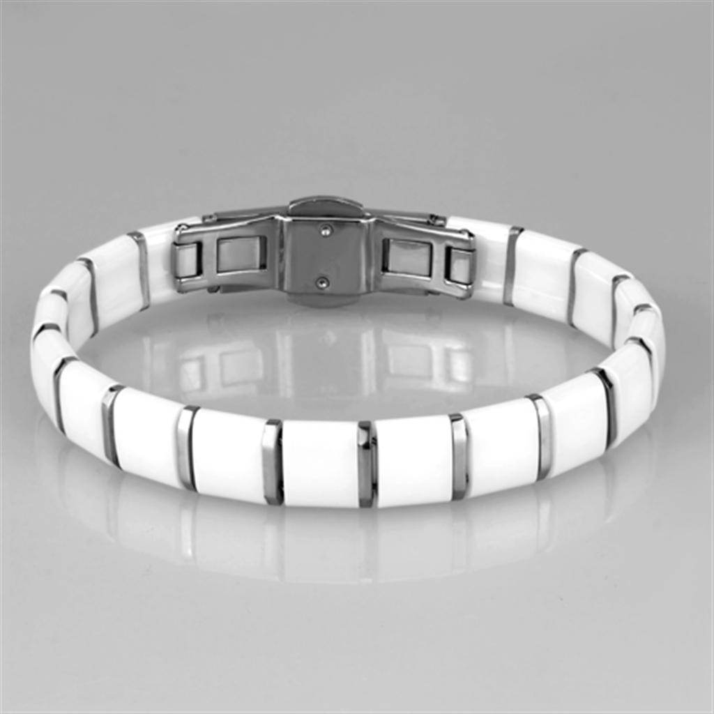 Stylish vacation jewelry for women, featuring a sleek white bracelet with a metallic clasp