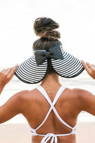 Aili's Corner stylish vacation sun hat with wide brims and a bow, perfect for beach outings