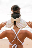 Aili's Corner stylish vacation sun hat with a wide brim and bow detail, perfect for beach outings