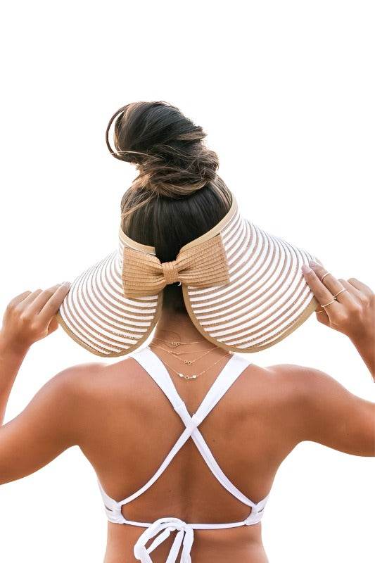 Aili's Corner stylish vacation sun hat with wide brim and bow detail, perfect for beach days