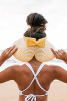 Aili's Corner stylish vacation sun hat with a bow design, perfect for beach days