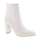 Stylish white boots for travel with a sleek design and block heels for comfort and elegance