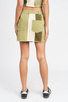 Back view of Emory Park summer fashion skirts in green with a stylish patchwork design