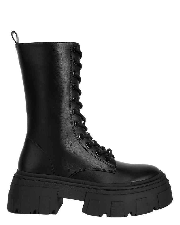 Black combat boot on a white background