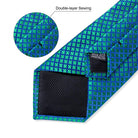 Teal blue paisley necktie with double-layer sewing for added durability and style