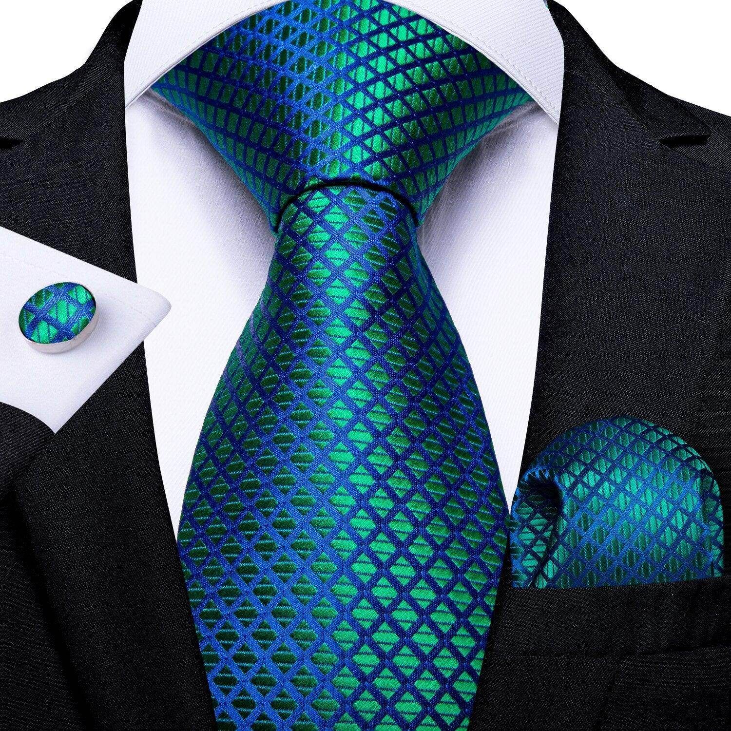 Teal blue paisley necktie with matching pocket square and cufflinks perfect for formal occasions