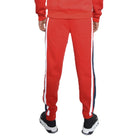 WEIV red three stripe sweatpants for men with white and blue side stripes worn with black and white sneakers