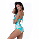 Woman wearing blue and green tie dye one piece swimsuit by Beach Joy Bikini with back tie detail