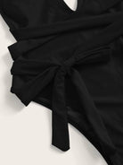 Trendsi tied one-piece swimwear in black with stylish tie detailing for a flattering fit