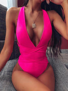 Trendsi tied one-piece swimwear in vibrant pink with deep V neckline and stylish wrap design