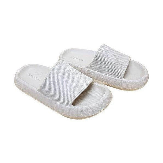 Women's vacation style sandals in white with a comfortable slip-on design for casual outings