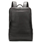 Sleek black leather travel backpack for men and women with spacious compartments and a minimalist design