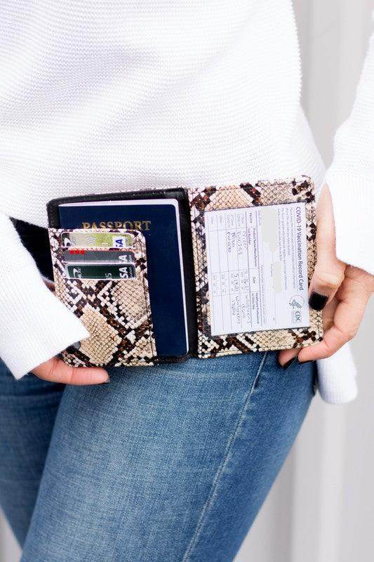 Stylish Aili's Corner travel credit card holder featuring a snake print design for passports and documents