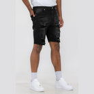 Men's ripped black denim shorts by WEIV, styled with a trendy camo shirt and shorts