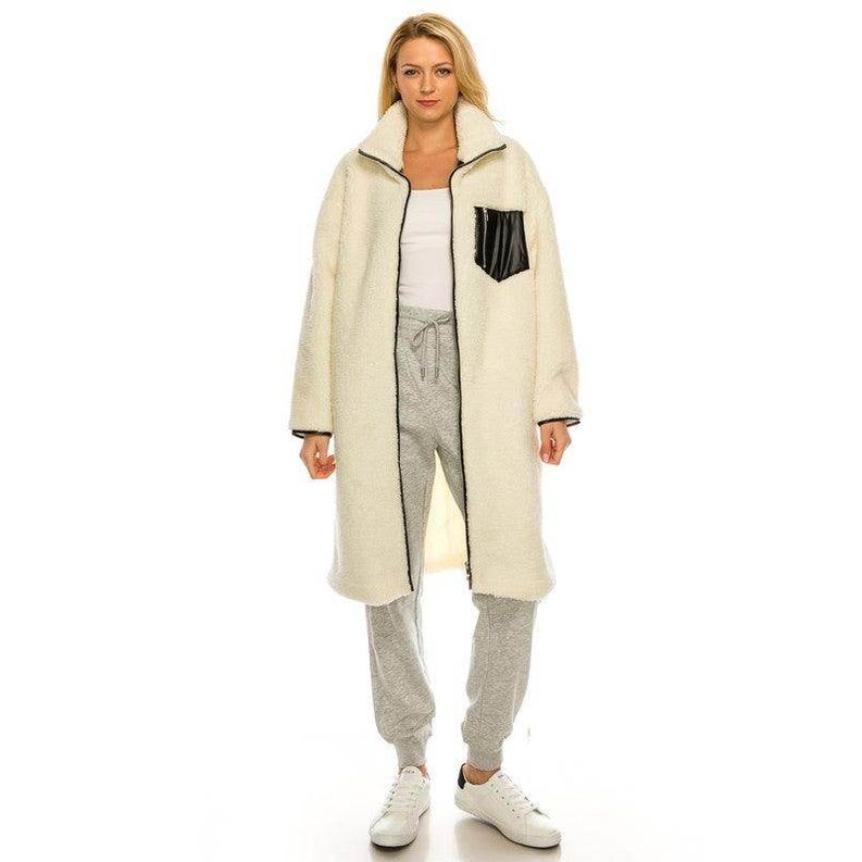 Cozy and stylish women's trendy ivory outerwear featuring a black pocket and soft fabric