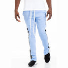 Blue trendy leather stripe joggers by WEIV with drawstring waist and black stripe detailing