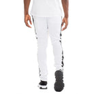 Back view of trendy leather stripe joggers in white with black leather stripes on sides