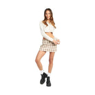 Trendy mini skirt vacation in plaid design, paired with a cropped top for a stylish look