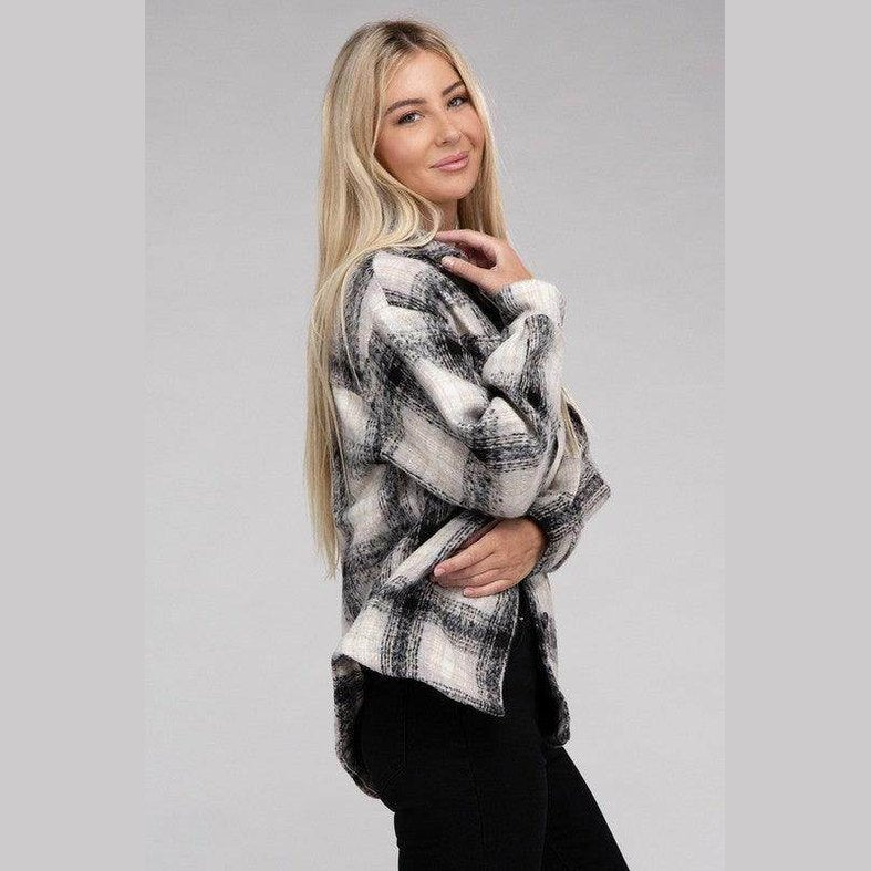 Trendy plaid shacket jacket in black and white on a model with long blonde hair