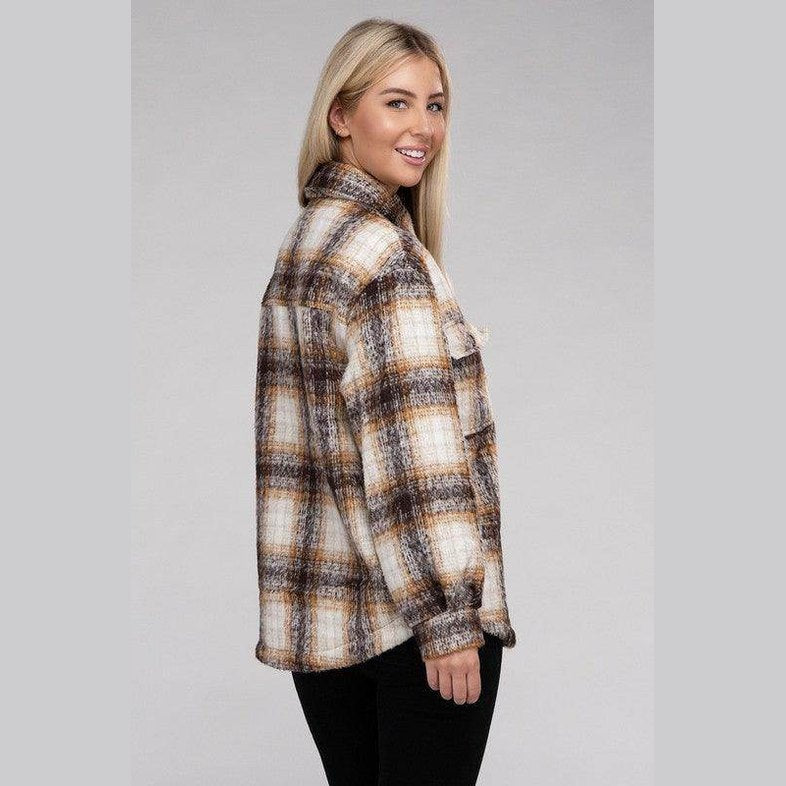 Stylish women's trendy plaid shacket jacket in brown tones, perfect for layering in any season