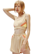 Miss Sparkling trendy retro activewear beige crop top and shorts set with orange and yellow accents