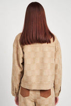 Back view of a stylish Emory Park trendy travel jacket in a soft beige pattern