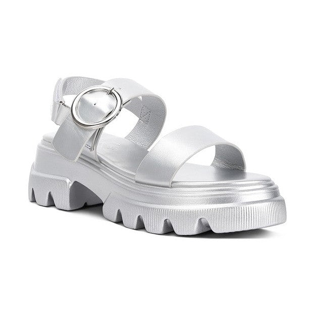 Trendy vacation footwear in silver with chunky soles and stylish buckle for summer outings