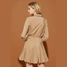 Back view of a Mustard Seed twisted belt shirt dress in beige with a flared skirt and long sleeves