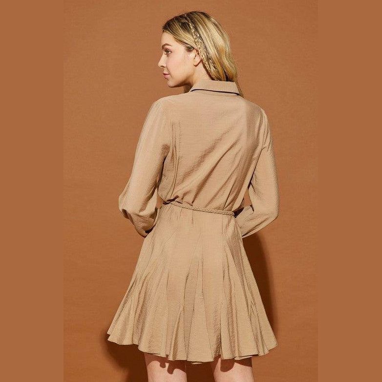 Back view of a Mustard Seed twisted belt shirt dress in beige with a flared skirt and long sleeves