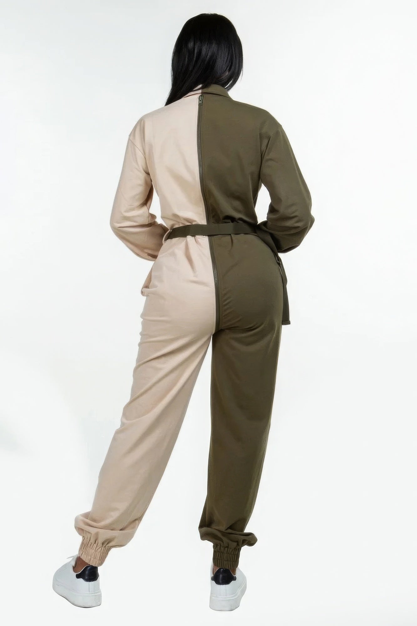 Back view of a women's two tone casual jumpsuit in beige and olive green with a relaxed fit