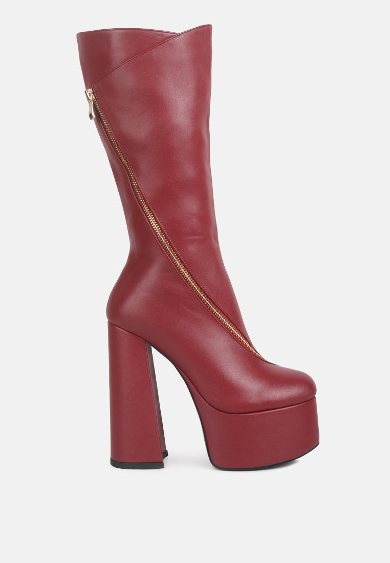 Red platform boot with a gold zipper on a white background