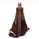 Back view of a unique leather handbag women with an adjustable strap and multi-texture design