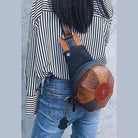Unique leather handbag women with a stylish round design, perfect for casual outings and trendsetters.