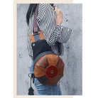 Unique leather handbag women with a stylish round design and multicolored accents for trendy looks