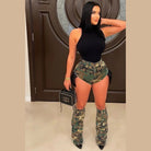 Model wearing camo short and leg warmer set with high waist distressed shorts and matching camo leg warmers
