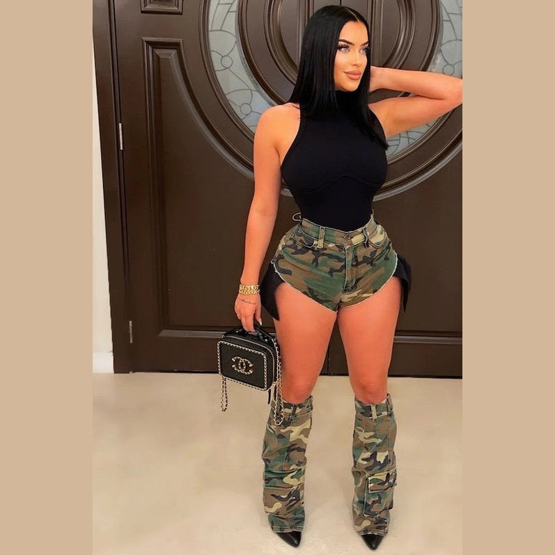 Model wearing camo short and leg warmer set with high waist distressed shorts and matching camo leg warmers